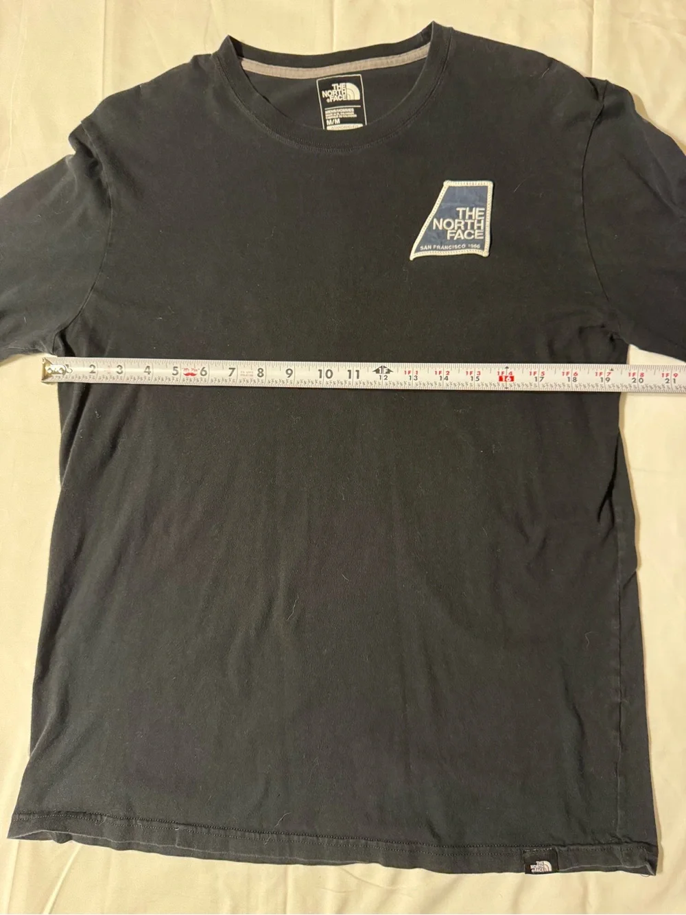 The North Face Black Long Sleeve Tee with Blue Logo Patch
